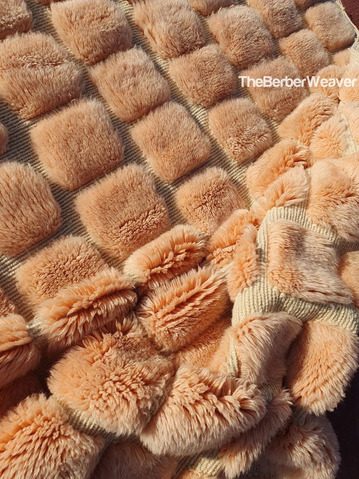 an image of a blanket that has been made out of fur and is laying on the floor