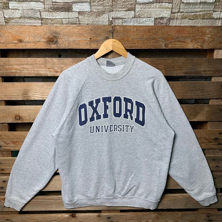 Vintage 90s Oxford University Sweatshirt Oxford Pullover Sweater Oxford Crewneck Jumper Oxford University Print Graphic Logo Grey Color Brand Name :-  📌 Tag Size :-  Large 📌 Recommend Size :- Large Manual Measurement :- WIDTH (armpit to armpit) :- 23 inches / 57cm LENGTH (shoulder to end of garment) :- 27 inches / 69cm Condition :- Good Condition 7/10. Minor Defect Stain Refer Picture. 📮FED EX / DHL EXPRESS = 3-6 business day arrived Vintage Sweater With Letter Print And Long Sleeves, Vintage Long Sleeve Sweater With Letter Print, Vintage Crew Neck Tops For Campus, Vintage Winter Campus Sweatshirt, 90s Long Sleeve Sweater With Letter Print, Vintage Long Sleeve Tops For Campus, Vintage Long Sleeve Sweatshirt For Campus, Vintage Crew Neck Sweater For College, 90s Style Sweater For College In Winter