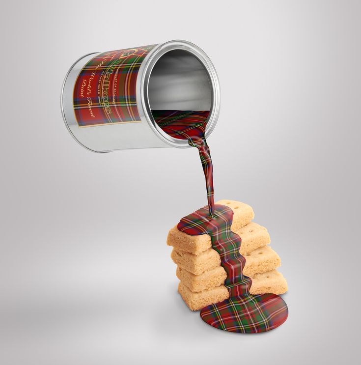 a can pouring red wine into cookies on top of each other, with the image of a stack of shortbreads in front of them