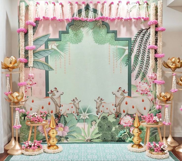 an elaborately decorated stage with pink flowers and gold decorations on the sides, in front of a mirror