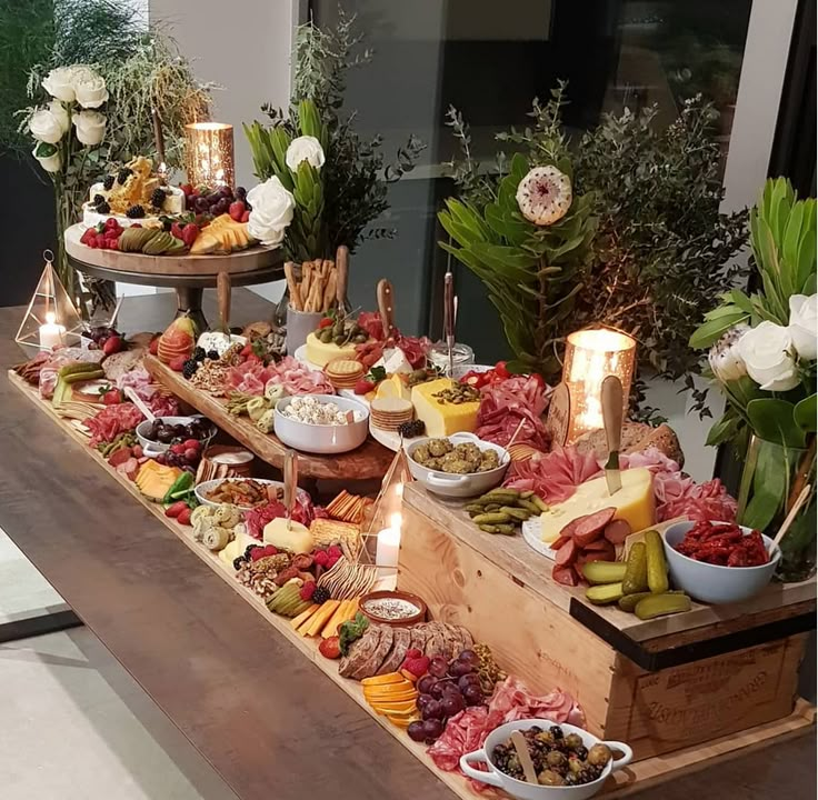 a buffet table filled with lots of food