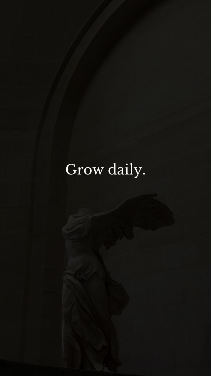 an angel statue with the words grow daily