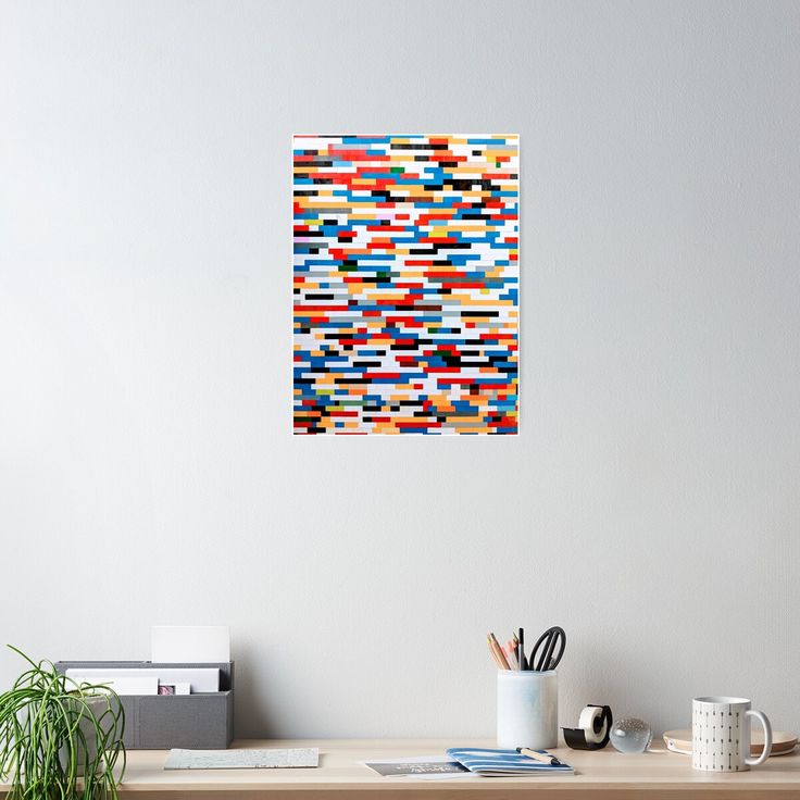 an abstract painting on the wall above a desk with a computer and other office supplies