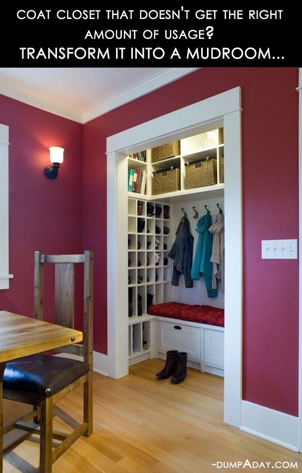 a dining room with a bench and coat rack in the corner next to a closet