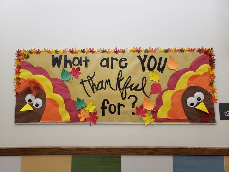 a bulletin board that says, who are you grateful for? with two turkeys on it