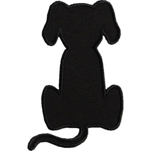 a black cat sitting down with its tail curled up in the shape of a dog