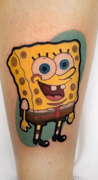 a cartoon character tattoo on the leg