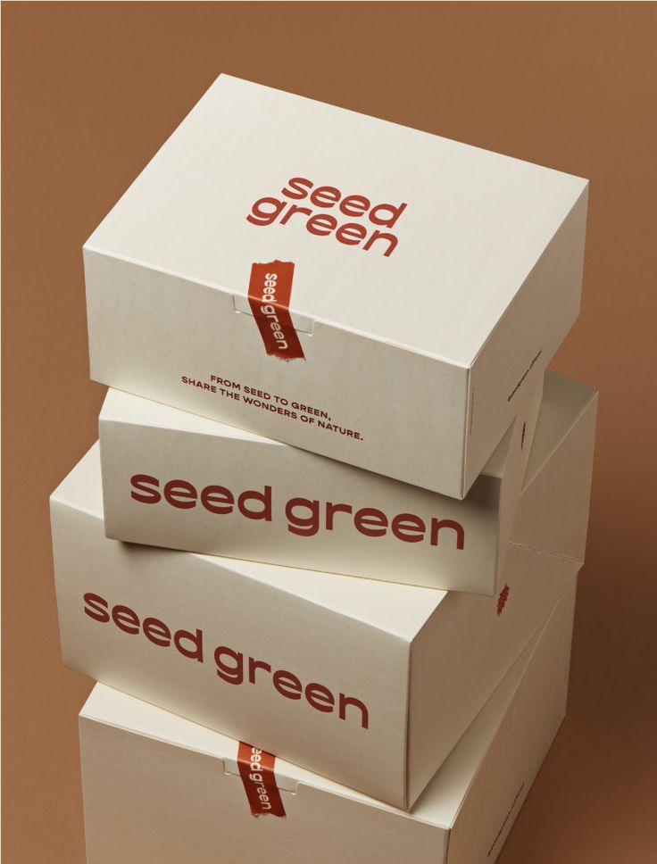 three boxes stacked on top of each other with the words seed green printed on them