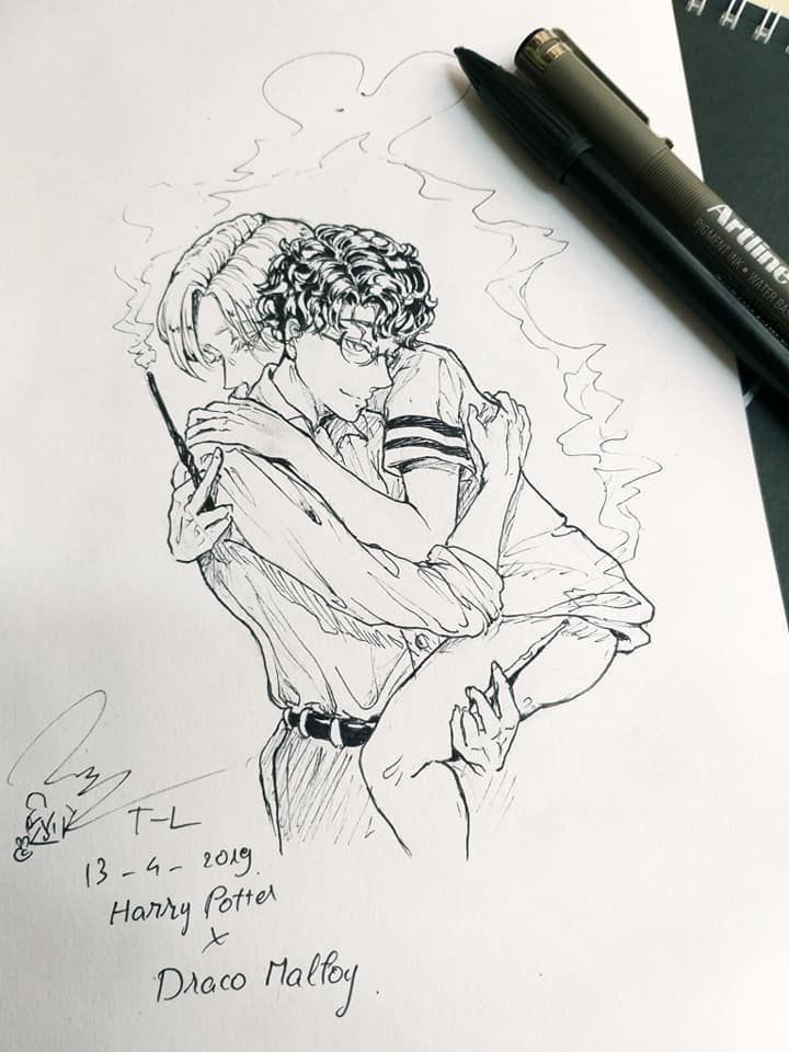 a drawing of a man hugging a woman on top of a piece of paper next to a pen