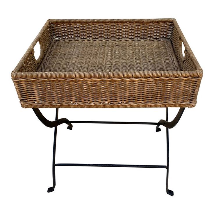 a wicker tray on a metal stand