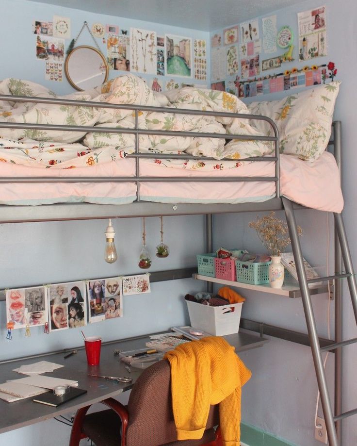 a bunk bed sitting next to a desk with a computer monitor on top of it