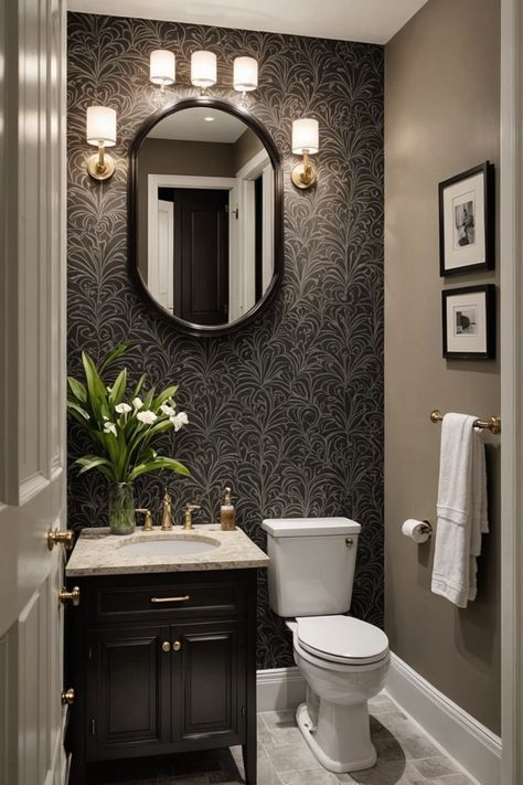 a white toilet sitting next to a sink in a bathroom under a large round mirror