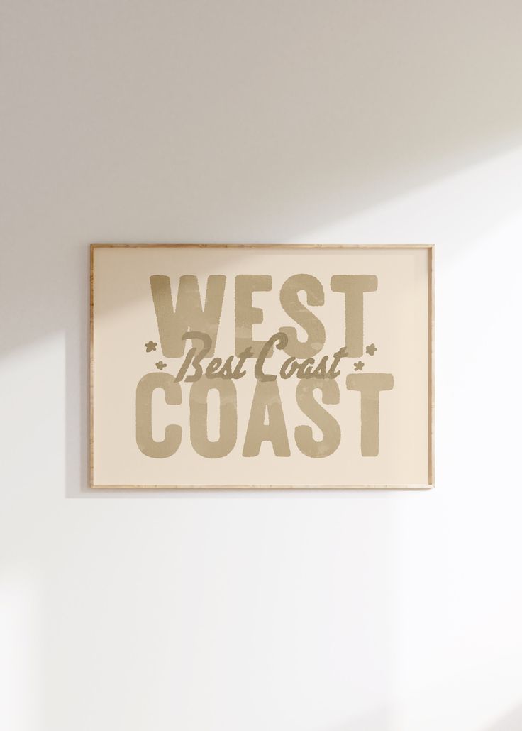 a white wall with a sign that says west coast