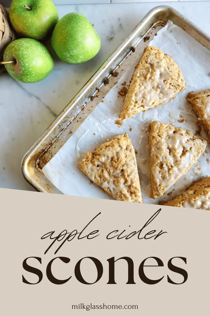 apple cider scones on a baking sheet with apples in the background and text overlay