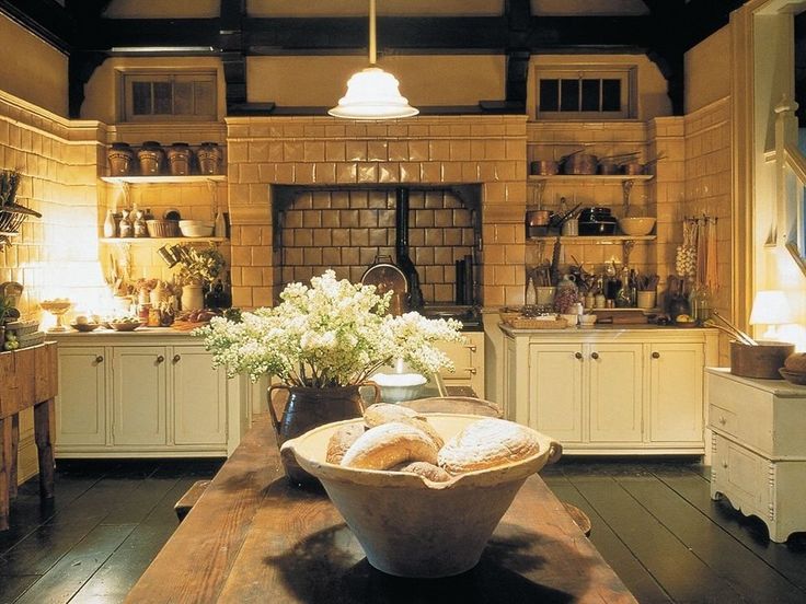 a large wooden table topped with a bowl filled with bread on top of it's side