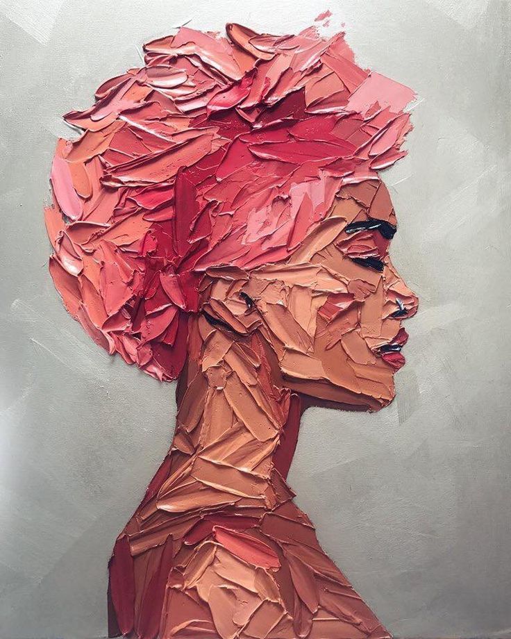 a painting of a woman's head with red hair and paper mache on it