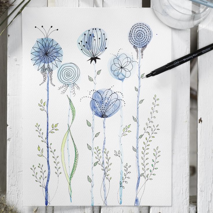 watercolor painting of blue flowers on white paper