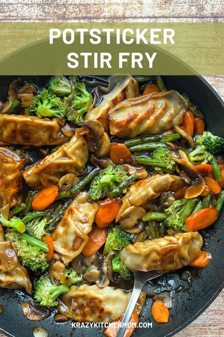 a skillet filled with chicken and broccoli on top of a wooden table