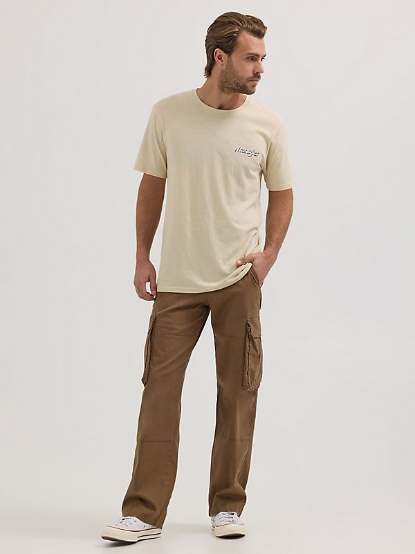 You can take everything with you whenever you wear our Men’s Ripstop Cargo Pant. Made to handle everything the day throws your way, these relaxed fit pants are as tough as they come. They’re crafted from a woven cotton fabric with just a hint of stretch. They feature a straight leg, roomy side pockets with extra compartments for essentials, back pockets, side pockets, a keychain belt loop, as well as a classic zip-fly and button closure. They won’t disappoint. Men Cargo Pants Outfit, Relaxed Fit Pants, Wrangler Pants, Gay Outfit, Cargo Pants Outfit, Carhartt Pants, Hiking Pants, Men's Apparel, Cargo Pant