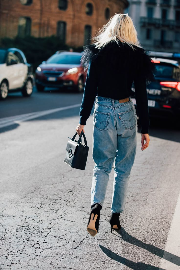 Seen on the street.  This dressed-up denim look was spotted on the streets of Milan Fashion Week. Photo: Jonathan Daniel Pryce Edgy Mid-rise Levi's Bottoms, Levis Editorial Photography, Levi's Black Streetwear Bottoms, Black Levi’s, Levi's Blue Full-length Jeans, Friday Outfit, Street Style 2017, Style Goals, Levis 501