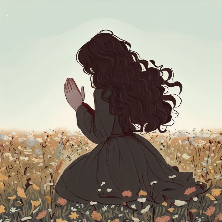 a woman sitting in a field with her hands together