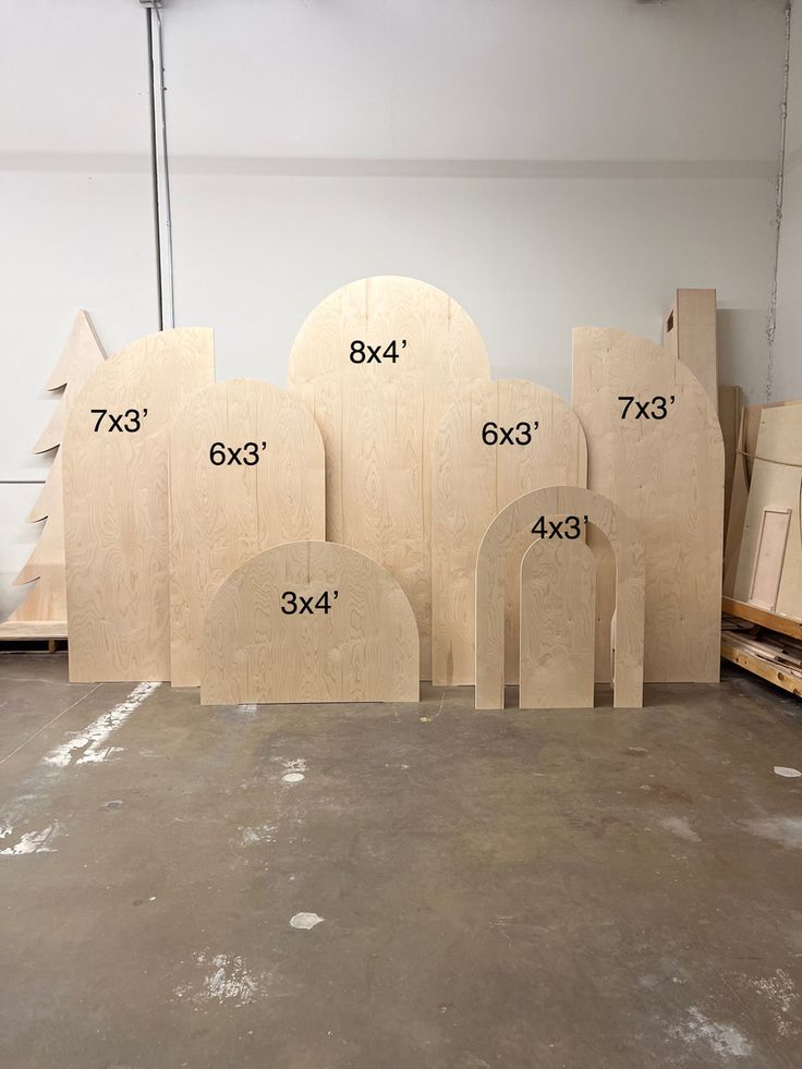 several pieces of wood sitting on top of a floor next to each other in a room