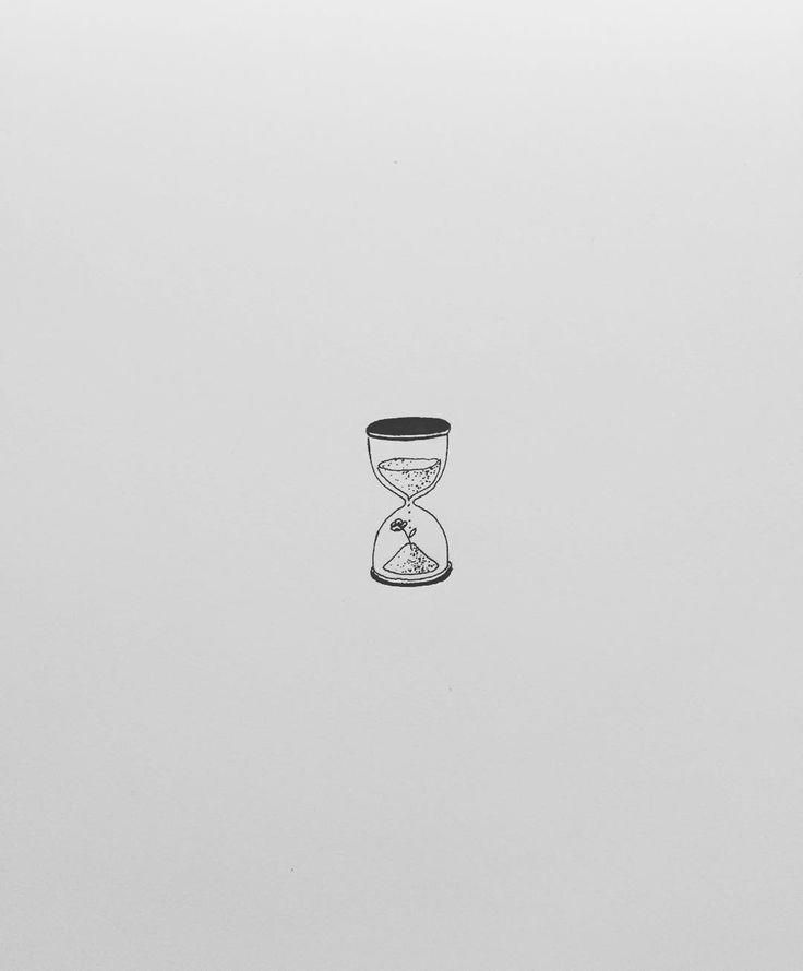 an hourglass sitting on top of a white surface