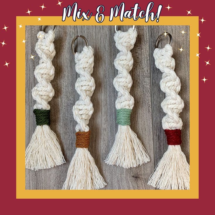 four white tassels with different colors on them