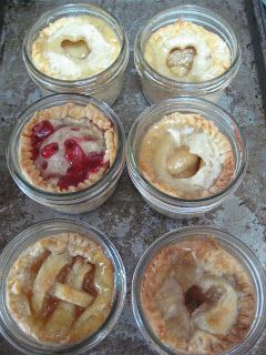 six pies with different toppings in glass containers