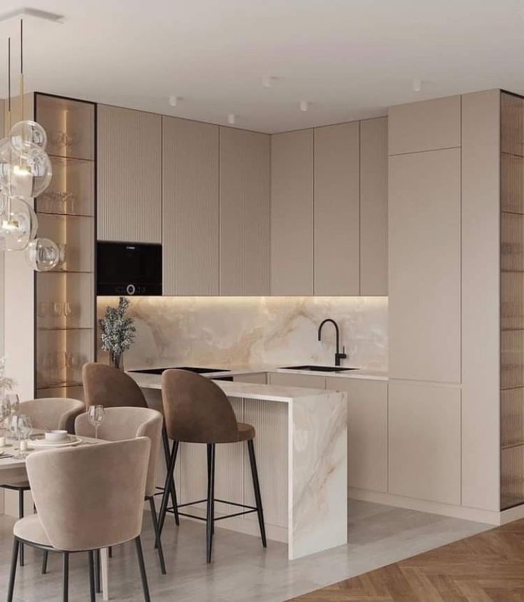 a modern kitchen and dining area with marble countertops, bar stools, and chairs