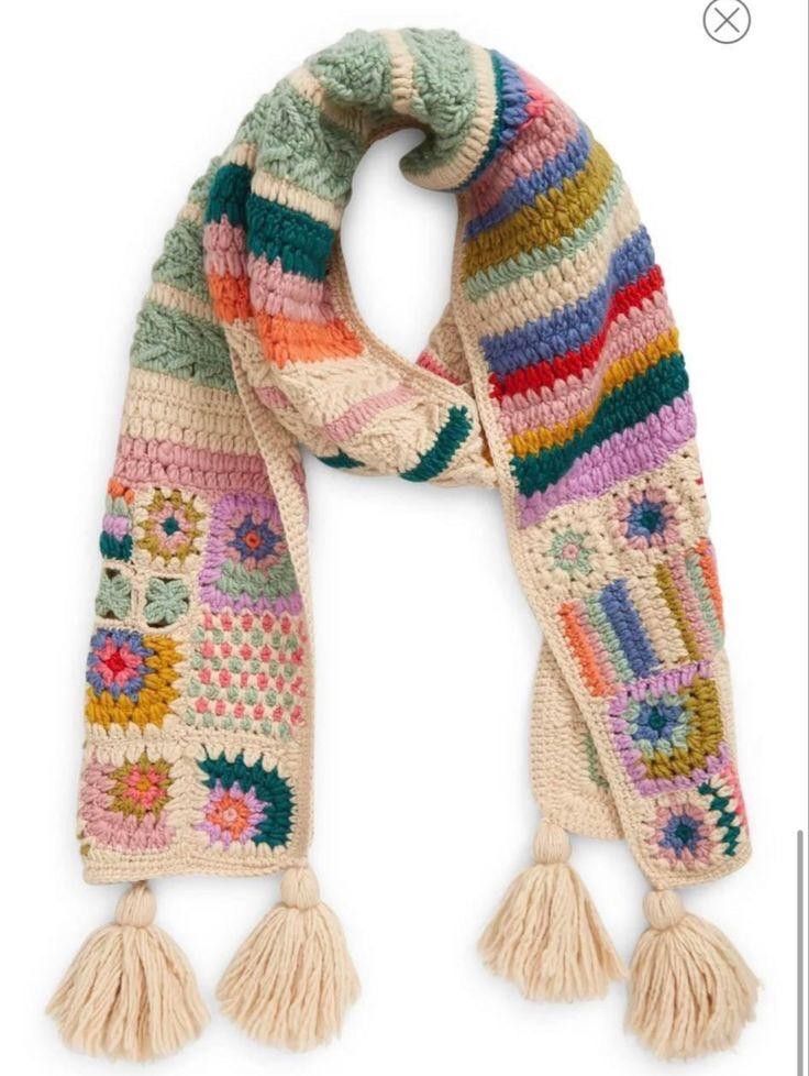 a multicolored knitted scarf with tassels