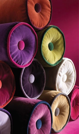 colorful pillows stacked on top of each other in the shape of an o - ring