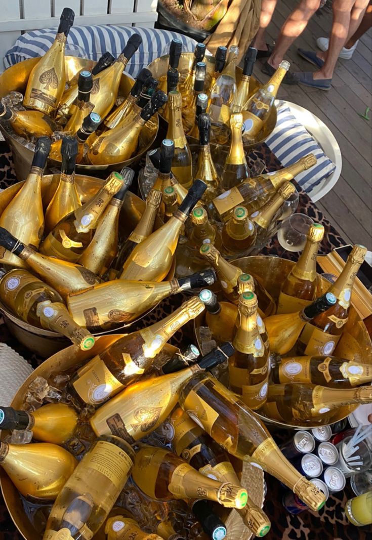 a table filled with lots of champagne bottles