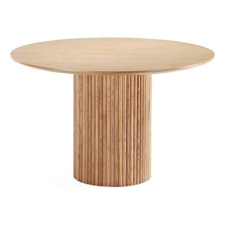 a round wooden table sitting on top of a white floor