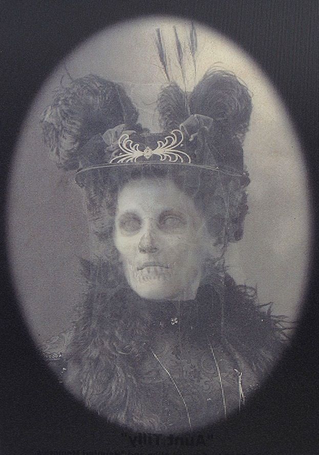 an old photo of a woman wearing a hat with feathers