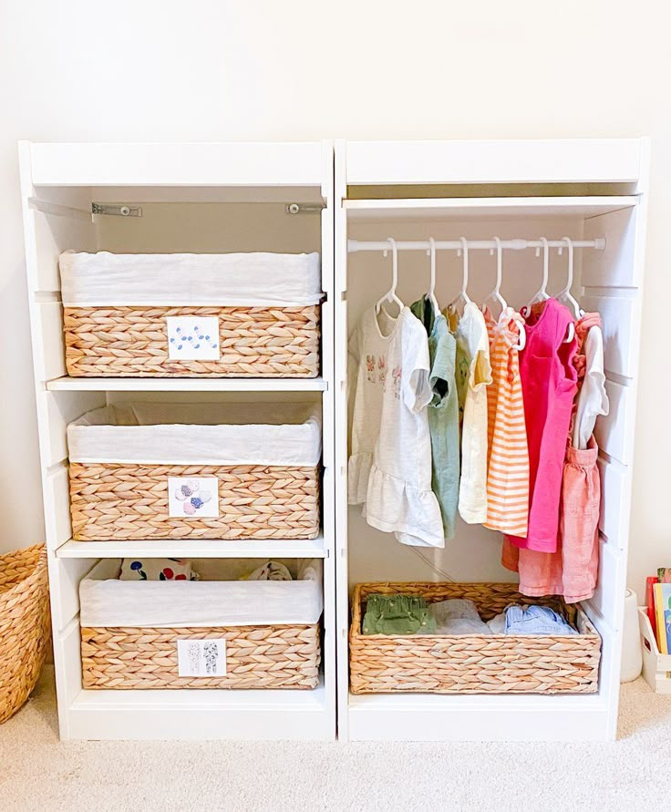 an organized closet with baskets and clothes