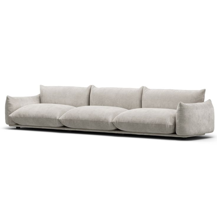 a white couch sitting on top of a wooden floor