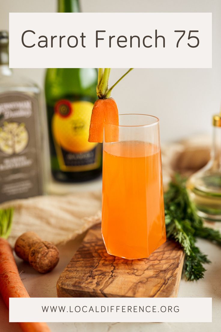 carrot french 75 cocktail in a glass on a cutting board