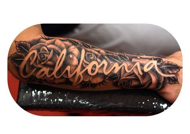 a man's arm with the word california on it and roses in black ink