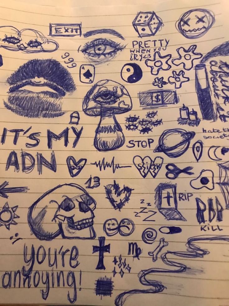 a bunch of doodles that are on top of a piece of paper with writing