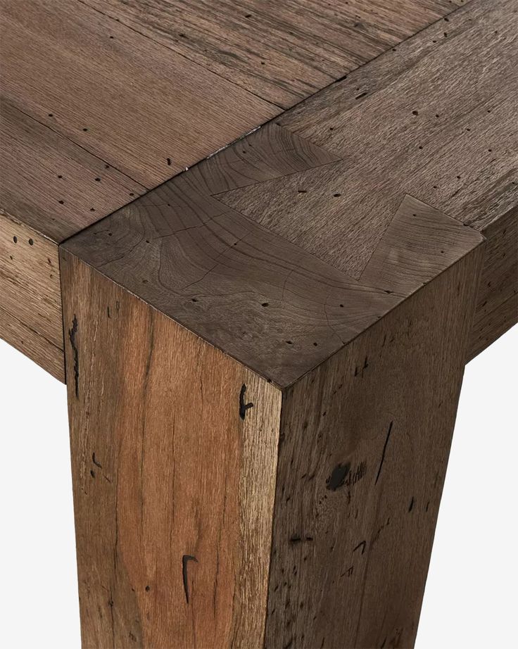 a close up view of the top of a wooden table with wood grains on it