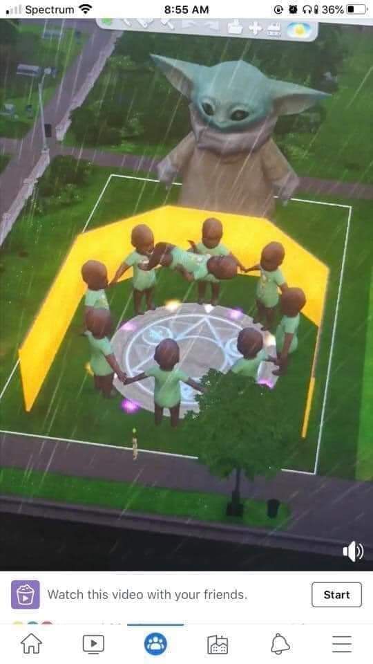 the baby yoda is standing in front of a group of people on a soccer field