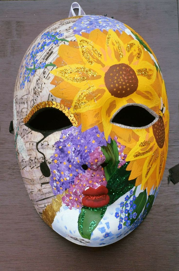 a colorful mask with flowers painted on it