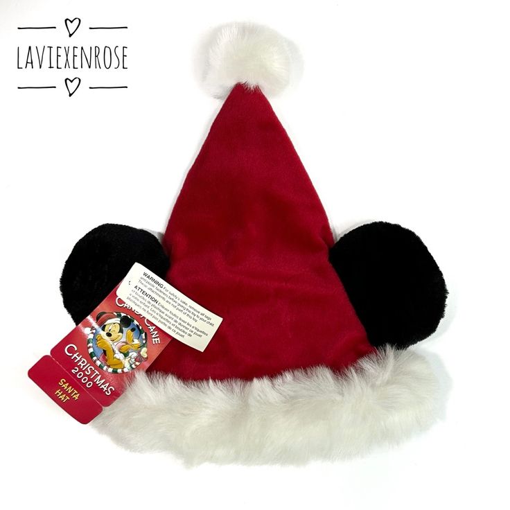 a red and black mickey mouse hat with a tag on it's side that says lavenrosee