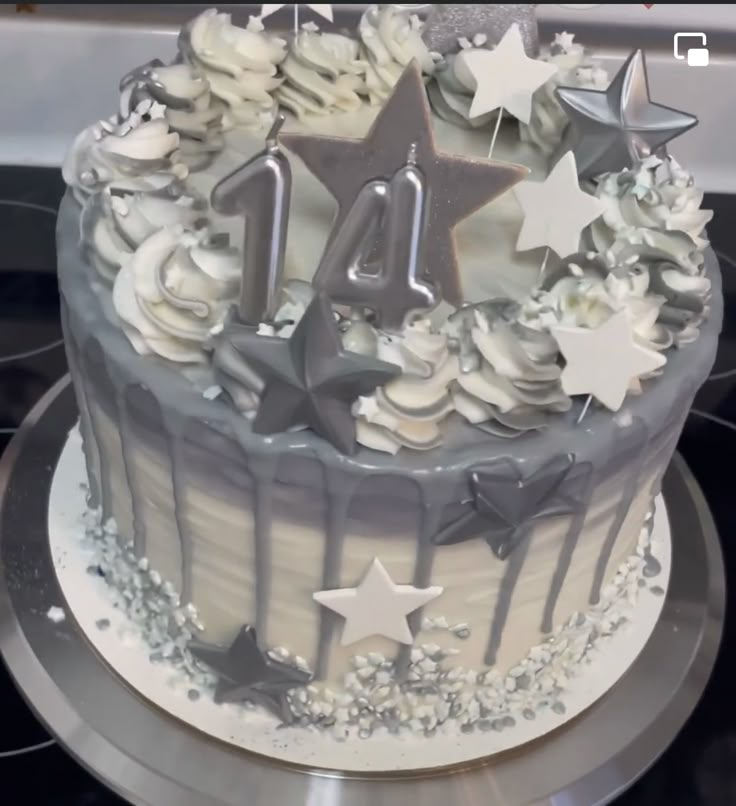 a birthday cake decorated with stars and icing