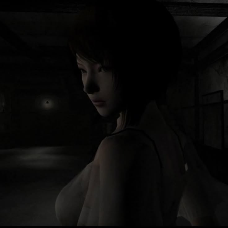 a woman standing in a dark room with her back turned to the camera and looking at something