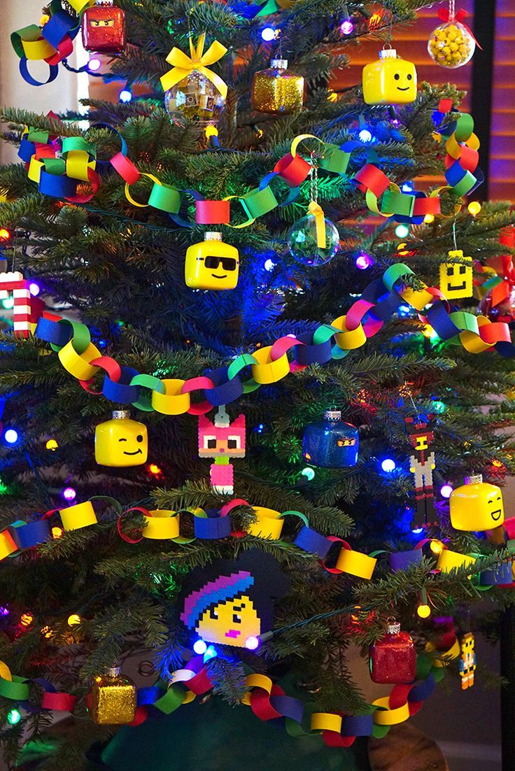 a christmas tree decorated with legos and lights