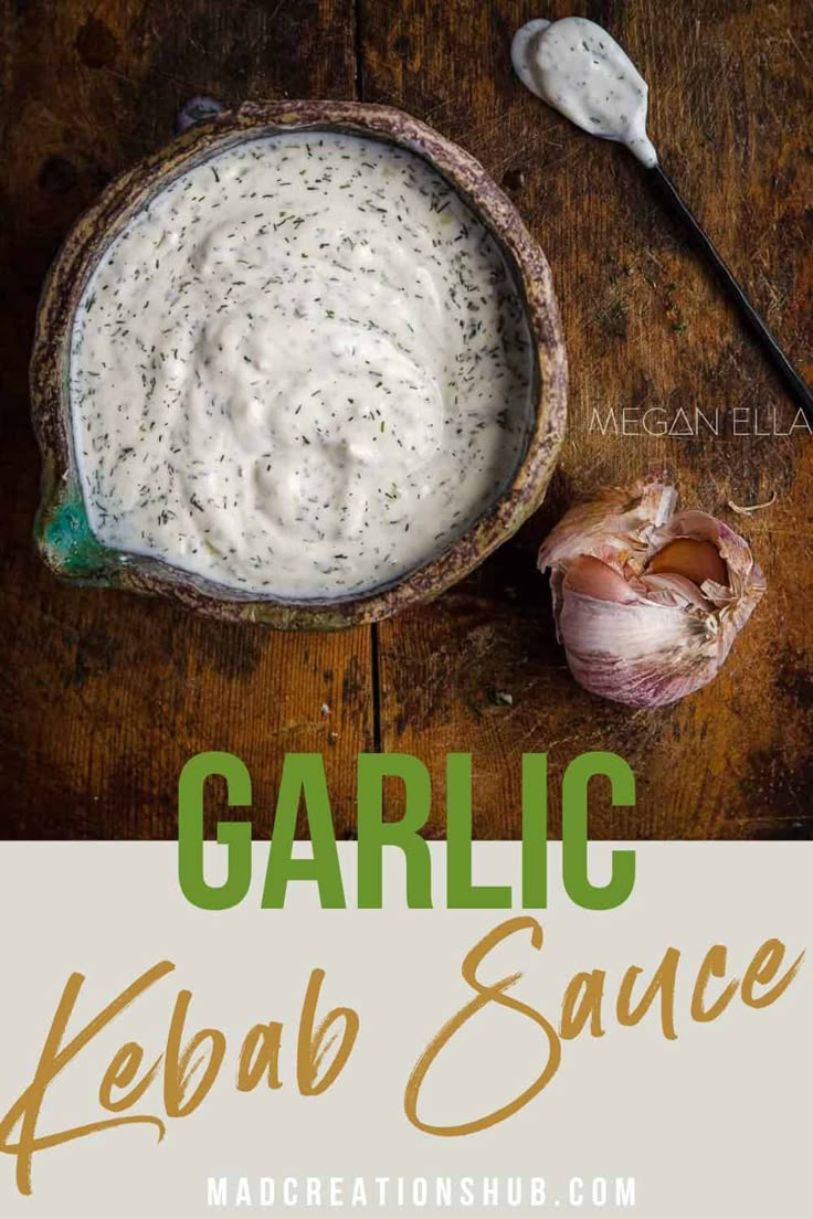 garlic kebab sauce in a bowl with spoons and garlic on the side