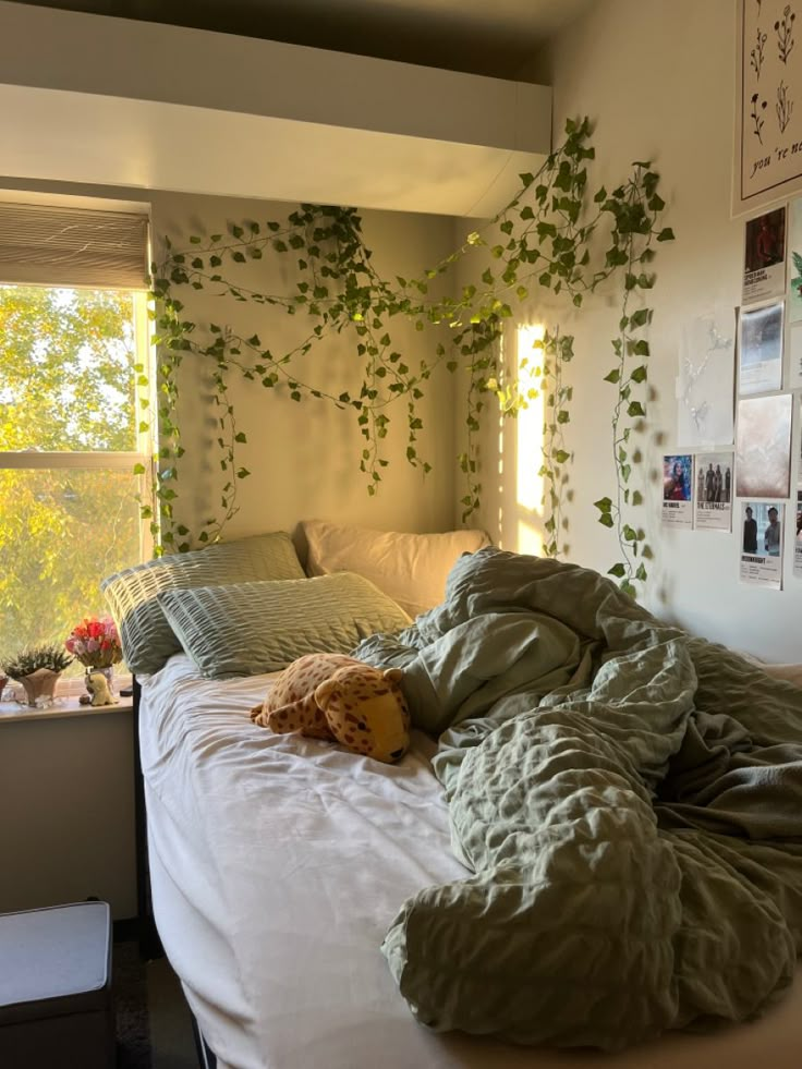 an unmade bed with plants growing on the wall