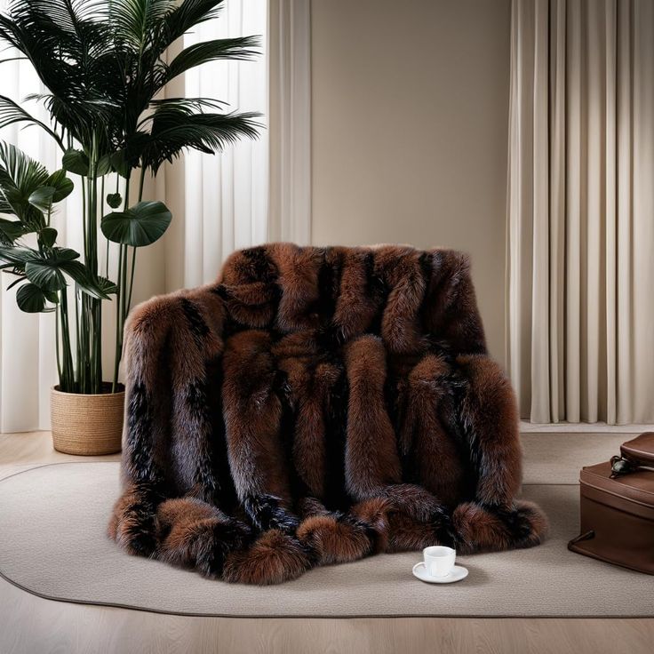 a fur covered chair sitting on top of a rug next to a potted plant